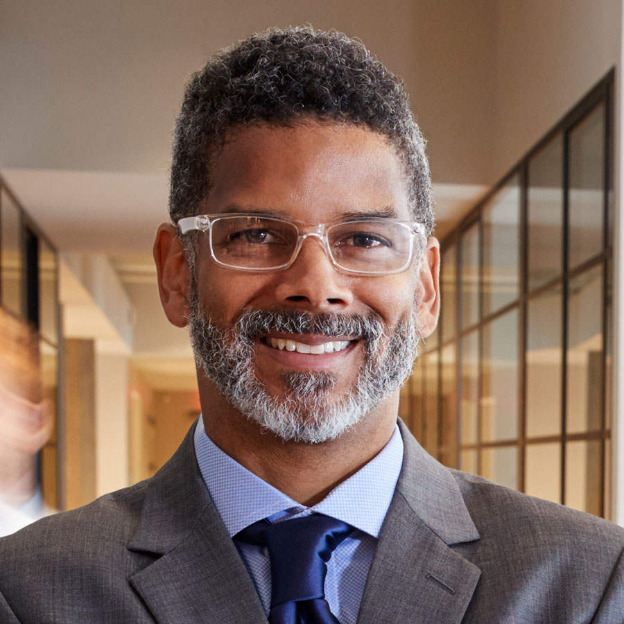 portrait-of-middle-aged-black-man-in-a-busy-modern-PZEKYNB.jpg